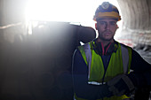 Worker standing in tunnel