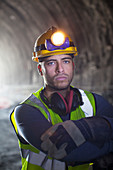 Worker standing in tunnel