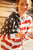 Woman wearing American flag sweatshirt