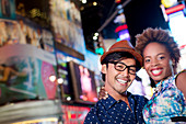 Couple smiling together on city street