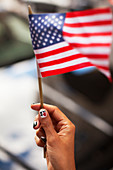 Woman waving American flag