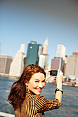 Woman taking picture of city cityscape