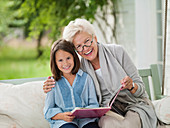 Woman and granddaughter smiling