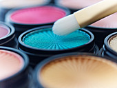Close up of makeup brush with eyeshadows