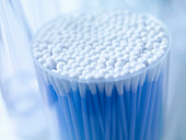Close up of cup of cotton buds