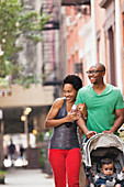 Family walking together on city street