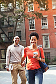 Couple walking together on city street