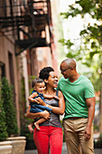 Family walking together on city street