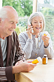 Older couple taking medication
