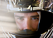 Close up of racer wearing helmet