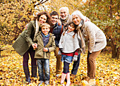 Family smiling together in park