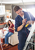 Electrician working in home