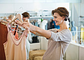 Woman shopping for clothes in store