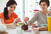 Women eating cake together