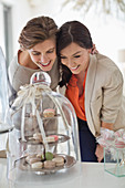 Women admiring tray of cookies