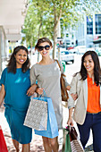 Women shopping together on city street