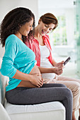 Pregnant women examining sonogram