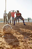 Boys playing soccer together