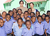 Students and teachers smiling outdoors