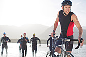 Triathletes emerging from water