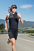 Woman running on rural road