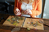 Woman arranging dried flowers