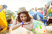 Smiling woman outside tents