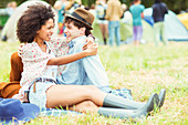 Couple hugging in grass