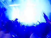 Silhouette of crowd facing stage