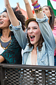 Woman cheering at music festival