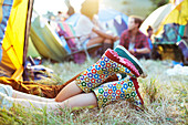 Couple's legs sticking out of tent