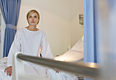 Patient sitting on hospital bed