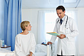 Doctor talking with patient room