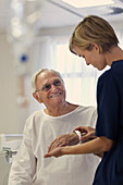 Nurse reading medical bracelet