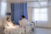 Doctor talking with patient room