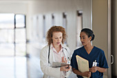 Doctor and nurse talking hallway