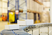 Packages on conveyor belt in warehouse
