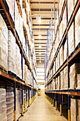 Aisle of boxes in warehouse