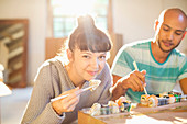 Couple eating sushi together