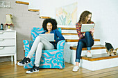 Women relaxing together on steps