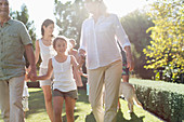 Family walking together in backyard