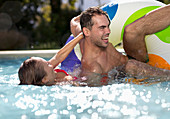 Couple playing in swimming pool