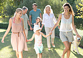 Family walking together in backyard