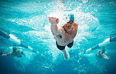 Swimmers racing in pool