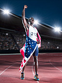 Track and field athlete wrapped in flag