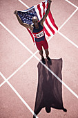 Track and field athlete holding flag