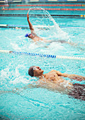 Swimmers racing in pool