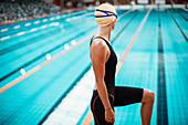 Swimmer standing at poolside