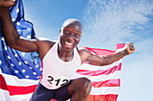Enthusiastic athlete holding flag