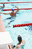 Swimmer celebrating in pool